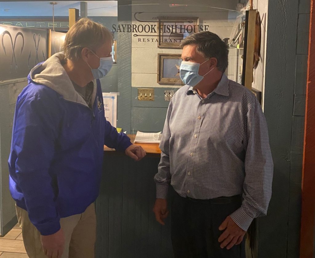 Sen. Witkos (L) meets with Joe Addonizio, owner of the Saybrook Fish House restaurant in Canton.