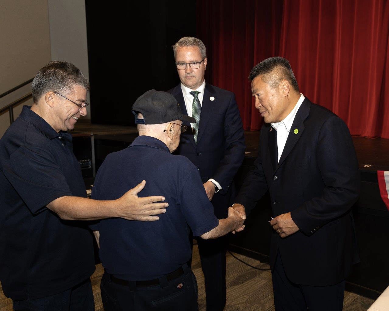 Sen. Tony Hwang (at right) thanks a veteran during the Sep. 21 Connecticut Wartime Service Medal Ceremony at Newtown High School.
